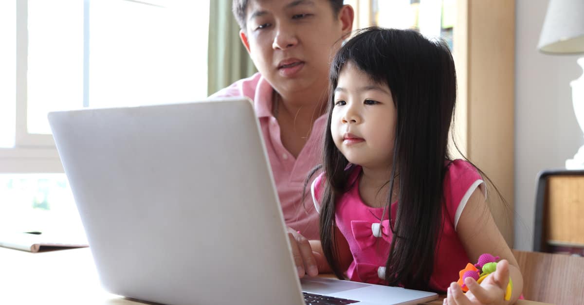 The Asian girl with laptop.